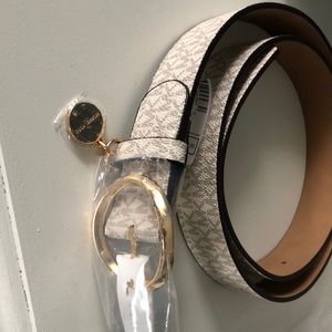 Brand new michael kors white belt with gold color buckle/charm
